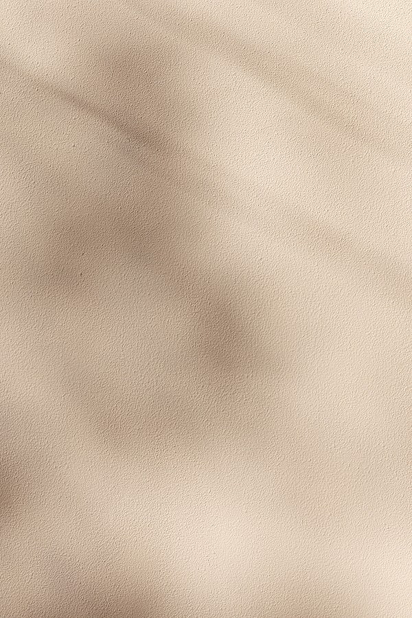 Textured beige background with subtle variations.