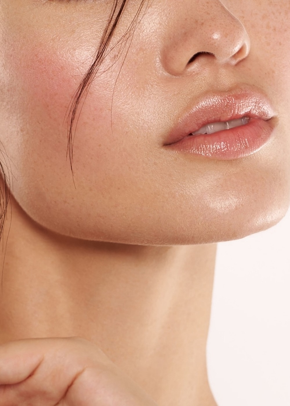 Close-up of lips and chin skin texture.